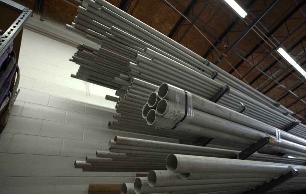 Industrial piping system components packaged and organized for project installation